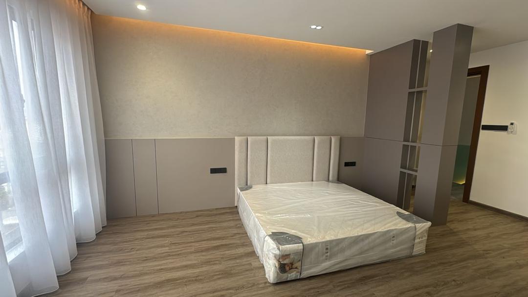 Master bedroom with upholstered headboard — Batu Cave